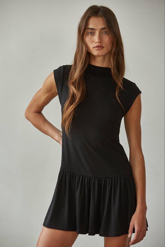 Short sleeve flare mini dress with a mock neck, made from soft knit fabric in a stretchy polyester-rayon-spandex blend.