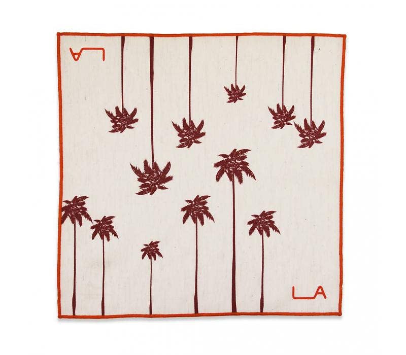 Handkerchief with red palm tree pattern and 'LA' logo on a white background