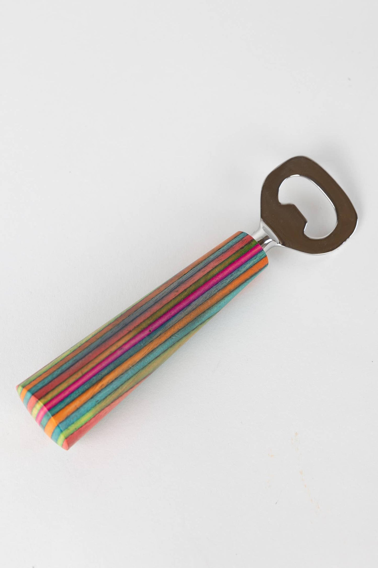 Colorful striped bottle opener on a white background
