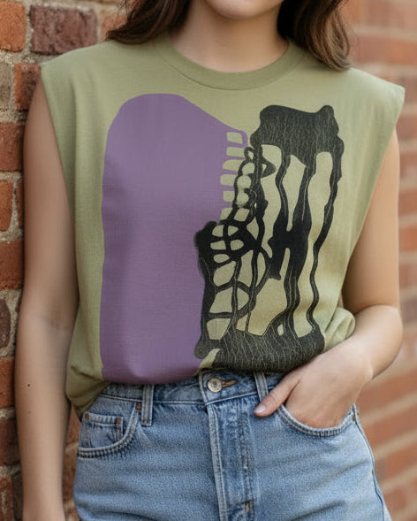 Green sleeveless shirt with purple and black design on a white background