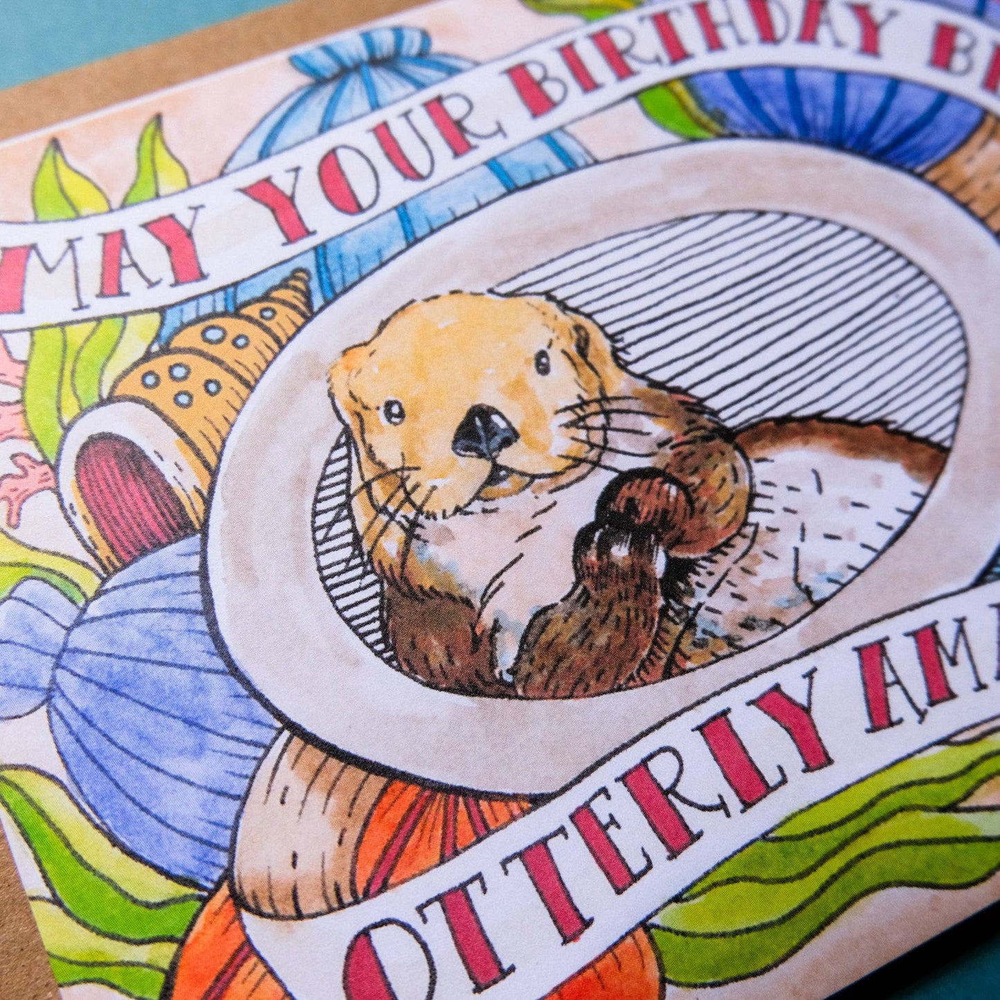 Birthday card with an otter illustration and colorful text