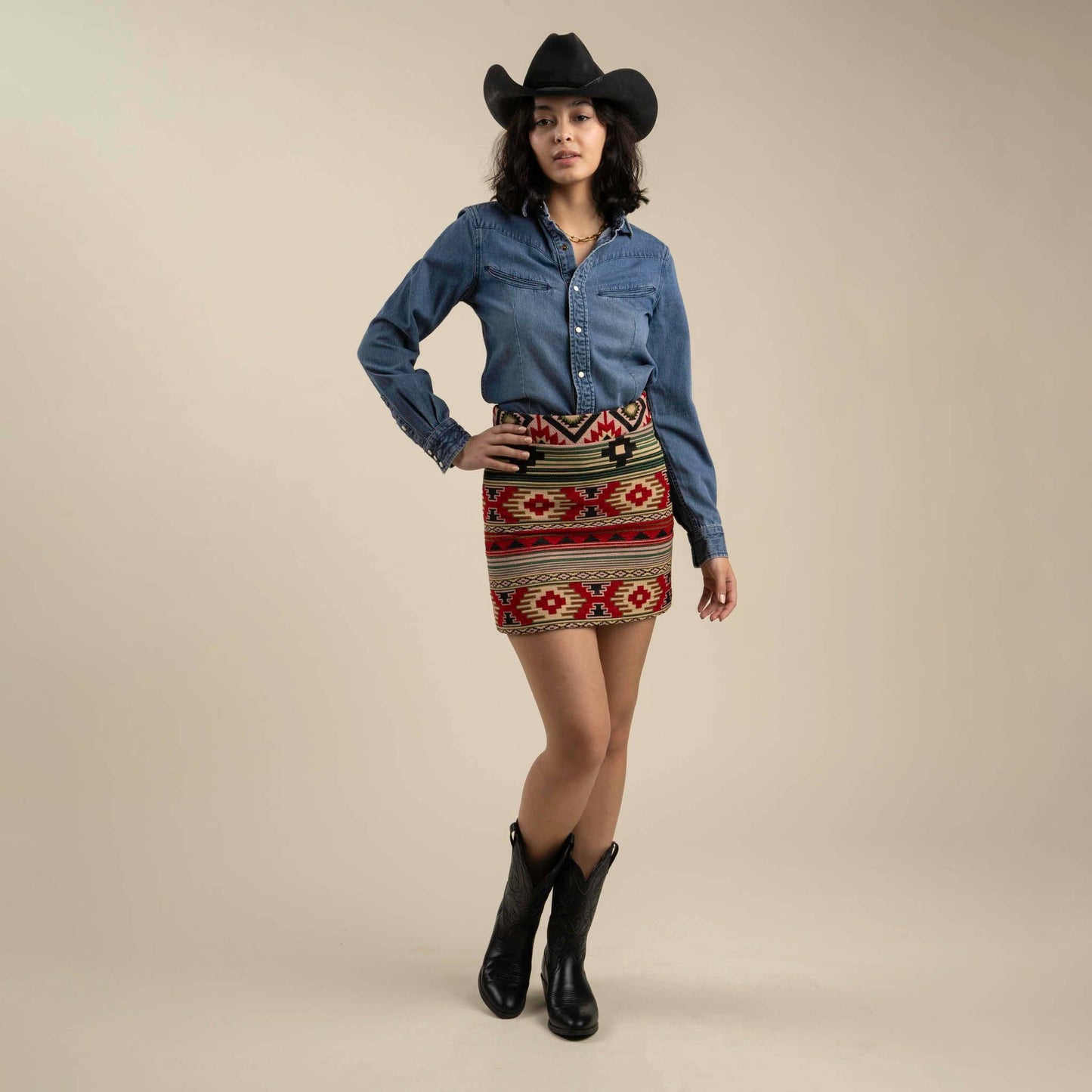Southwest-style skirt with bold patterns, fitted through the hips, and cut to mid-thigh; perfect for styling with boots or sandals.