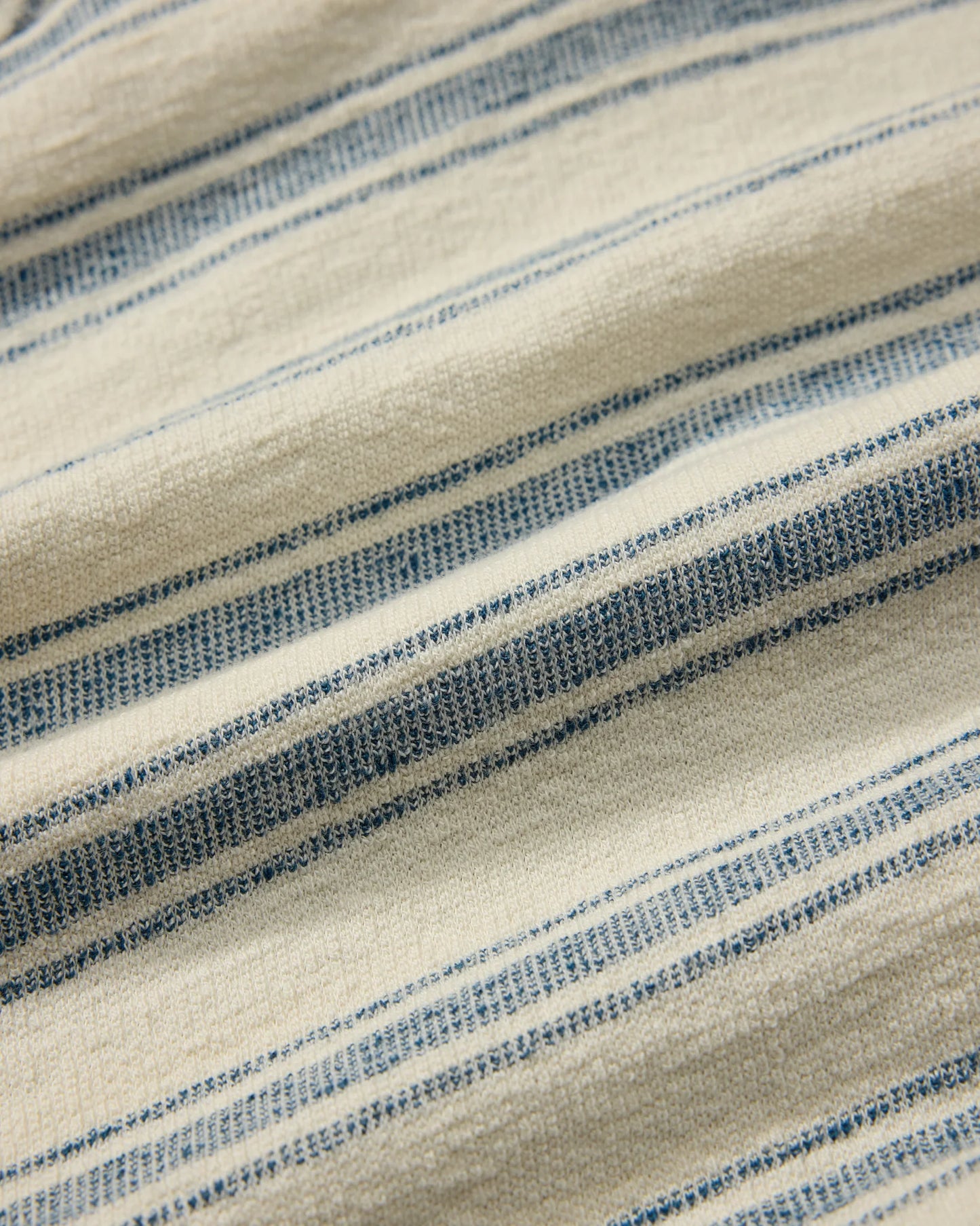 Close-up of fabric with blue and beige stripes
