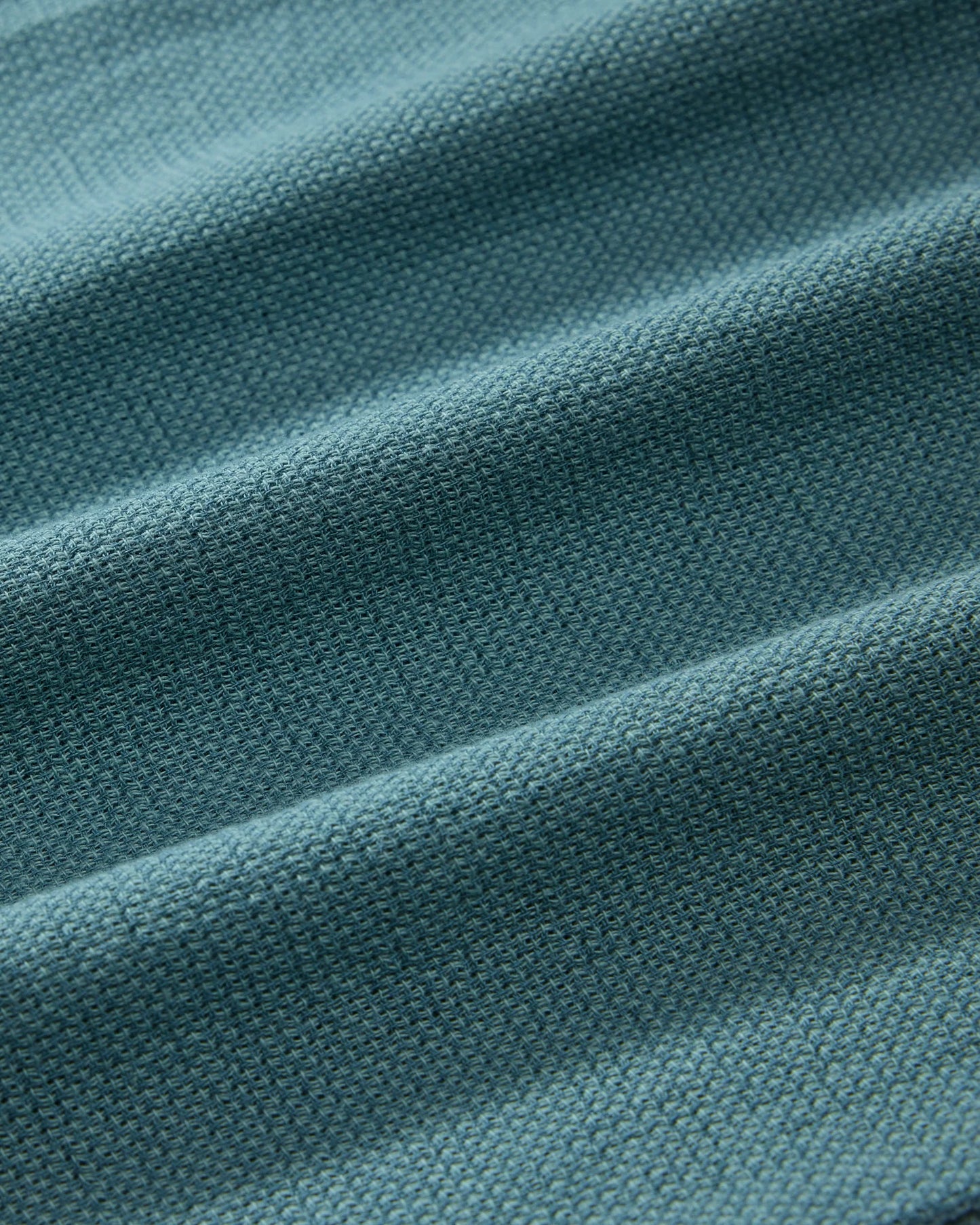Close-up of teal fabric with visible texture