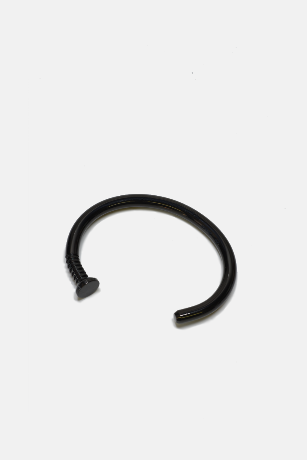 Black nail cuff on a white background
