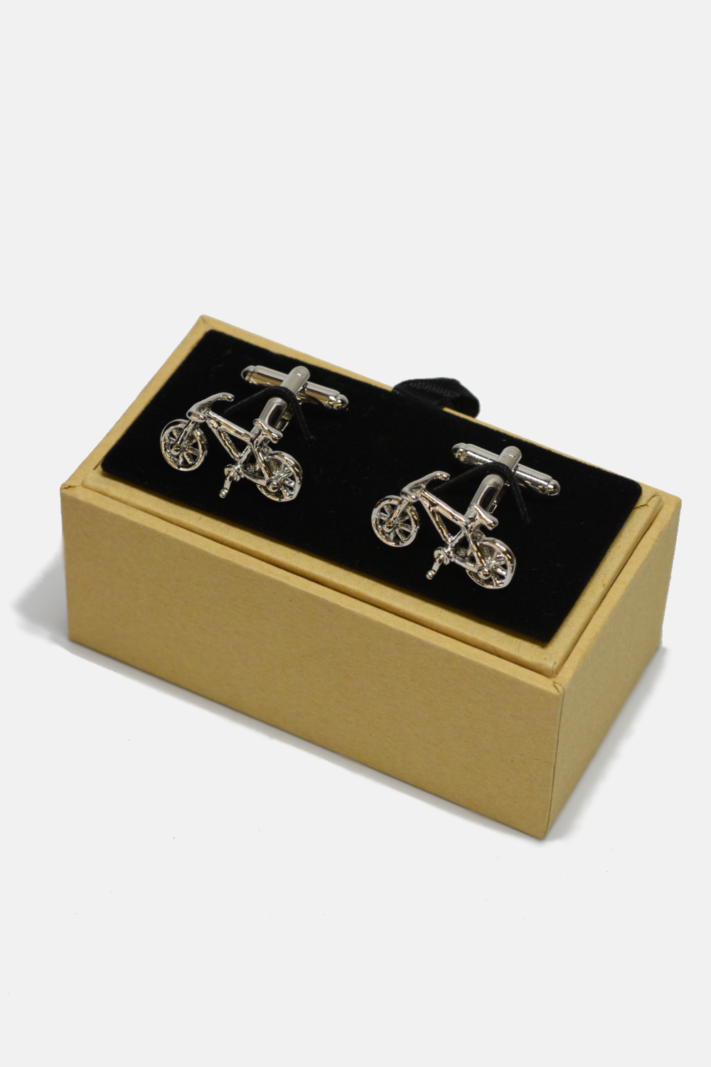Bicycle-themed cufflinks in a box on a white background