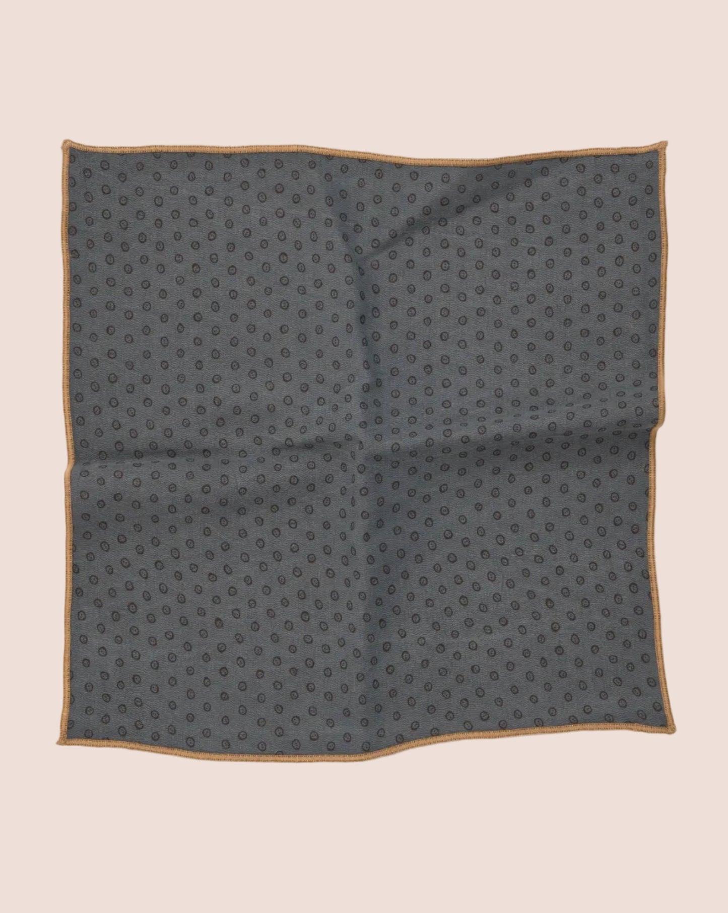 Gray pocket square with a subtle pattern on a light gray background