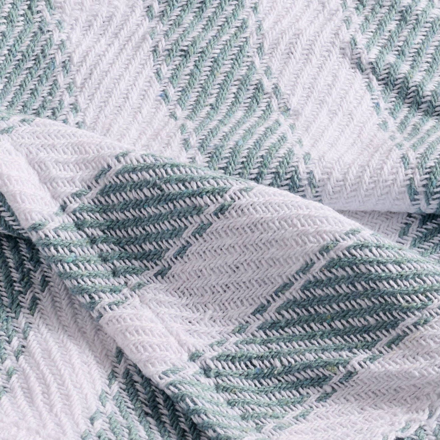 Close-up of textured fabric with green and white pattern