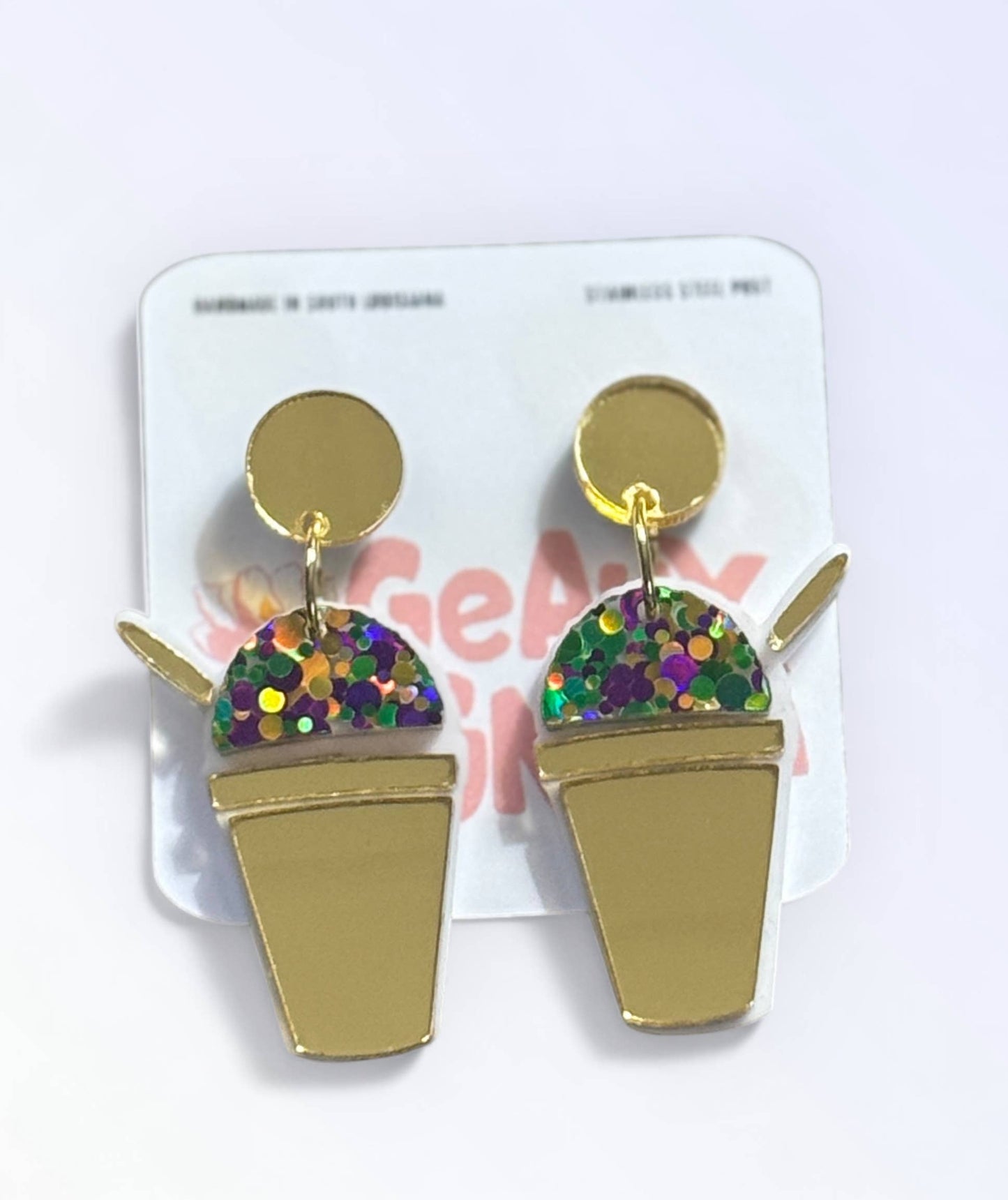 Gold ice cream cone earrings with colorful sequins on a white card