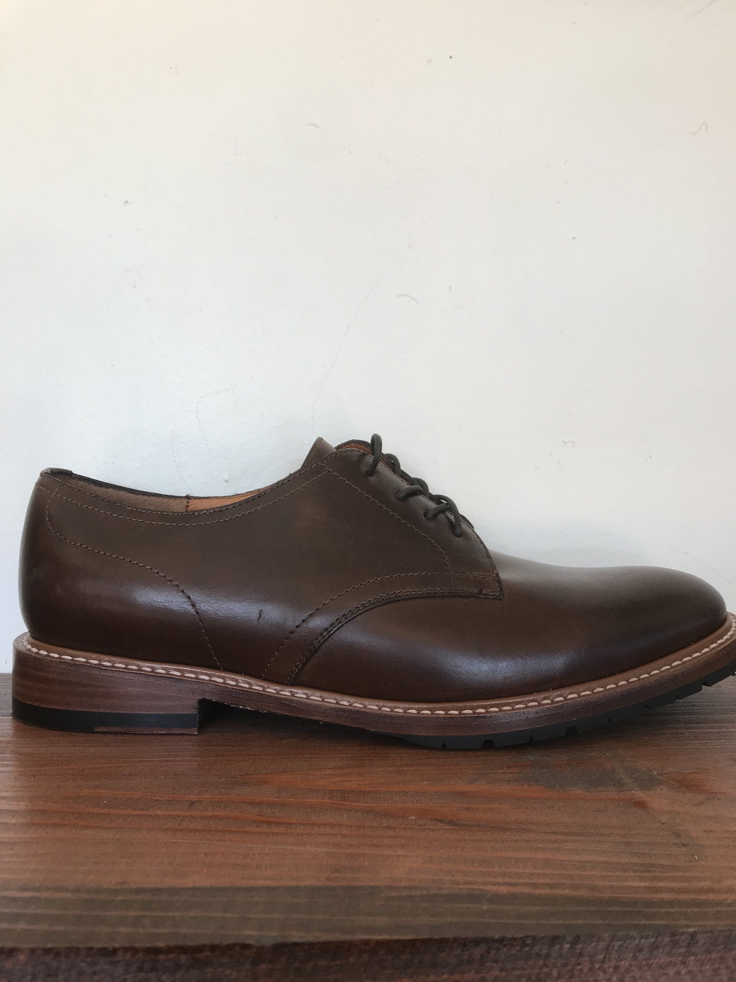 Side view of Harrington derby shoe showing elevated sole and lace-up design