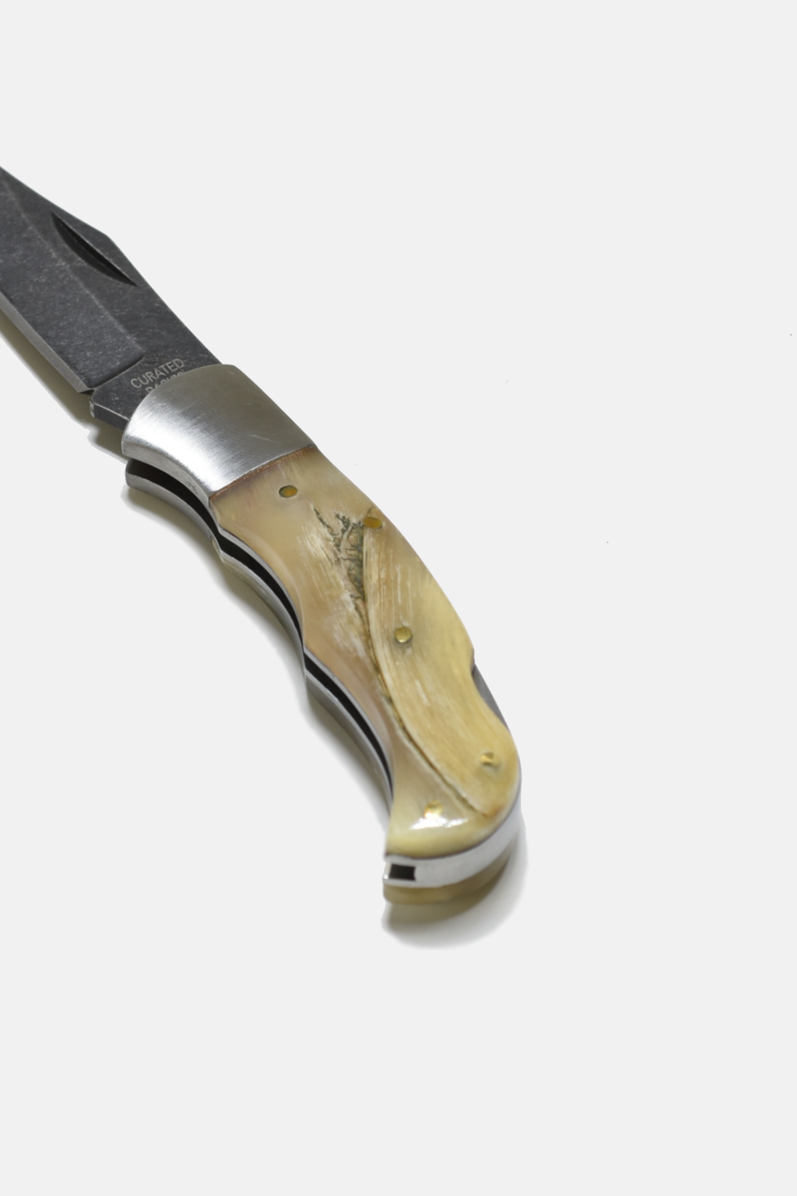 Folding knife with wooden handle on a white background