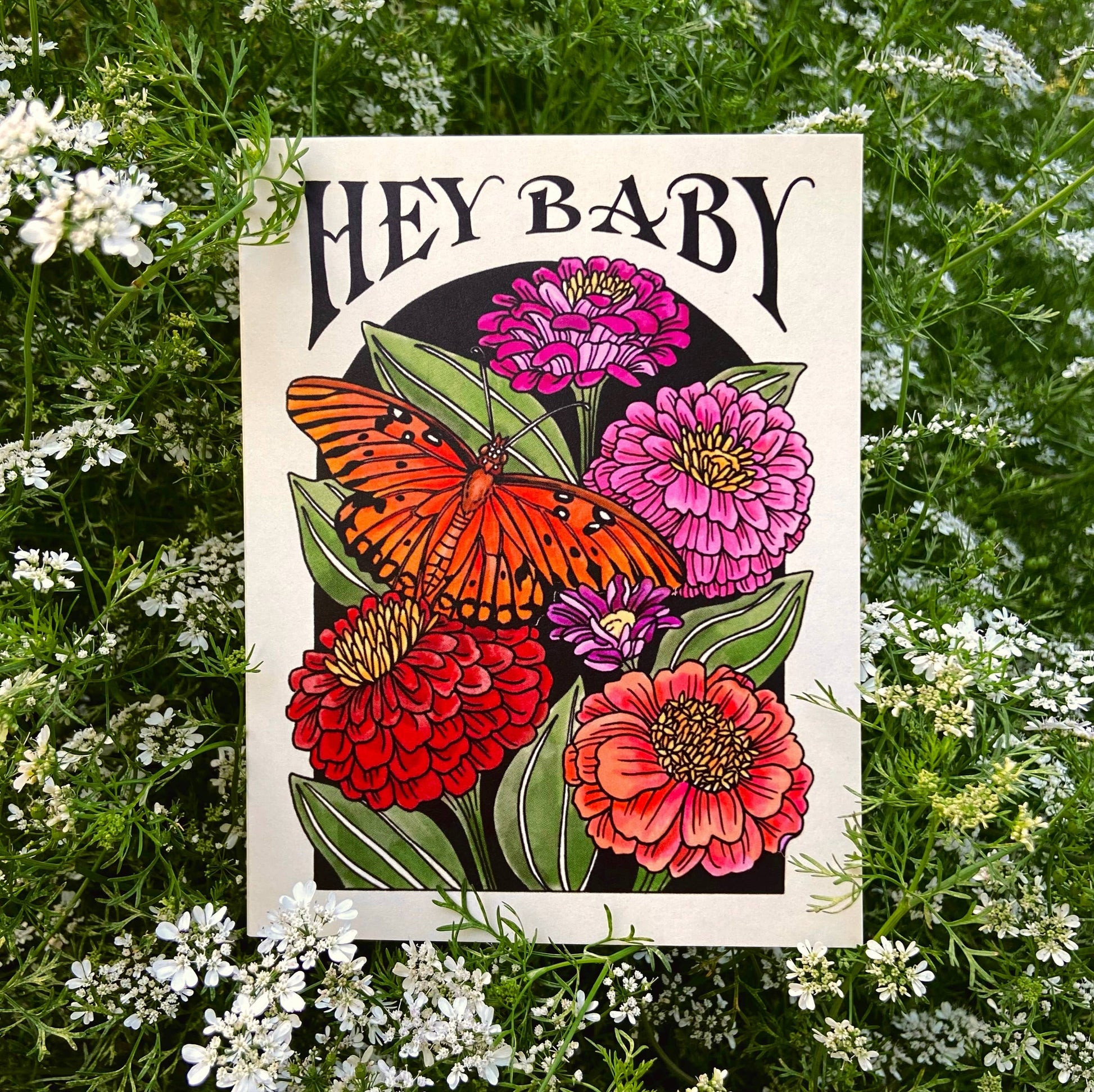 Card with flowers and butterfly design on a floral background