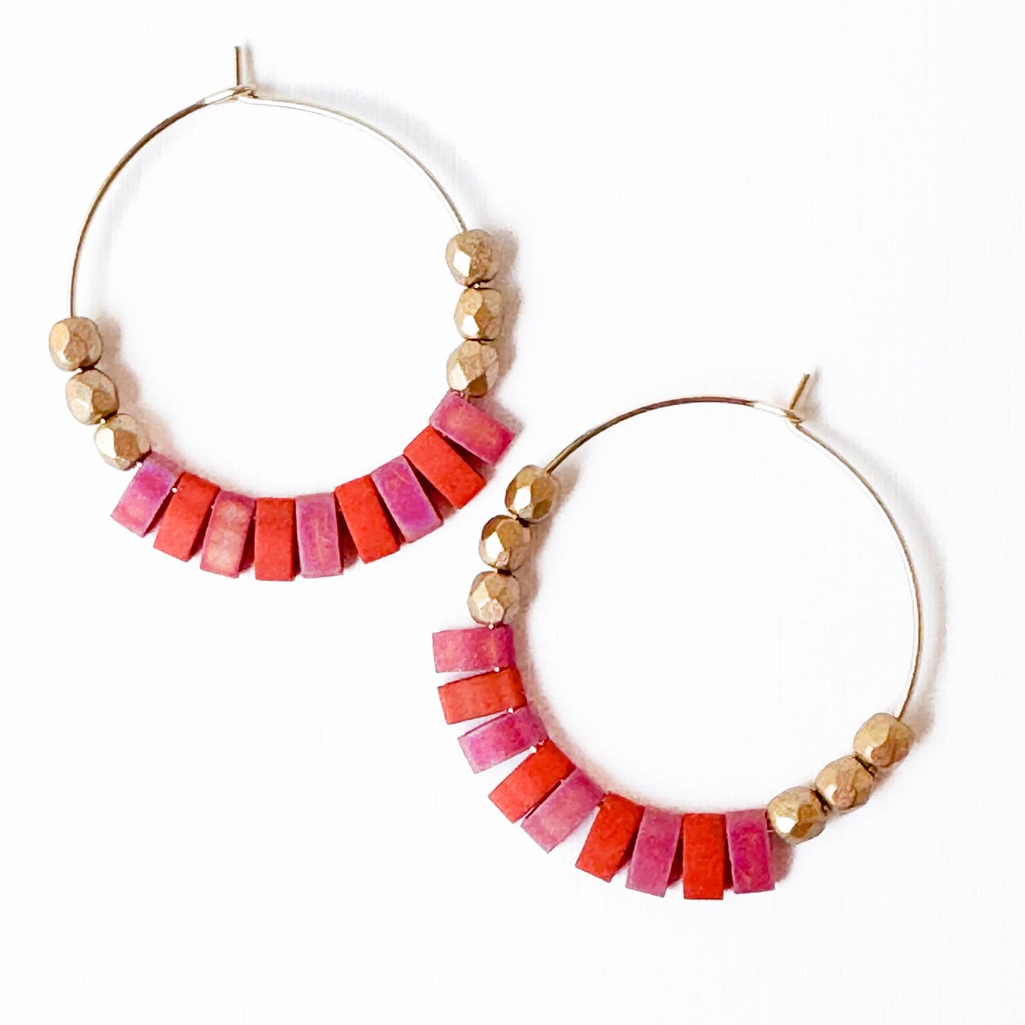 Hoop earrings with colorful bead accents on a white background