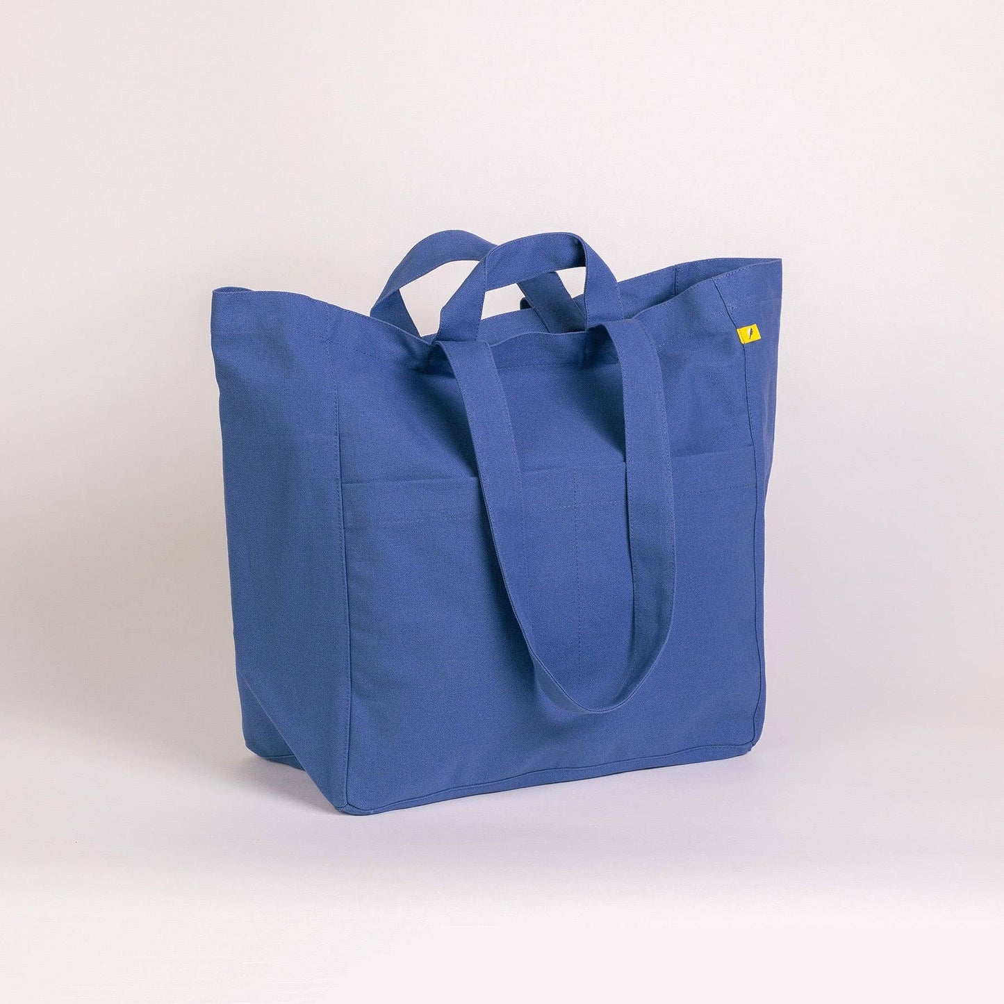 Blue tote bag on a light gray background