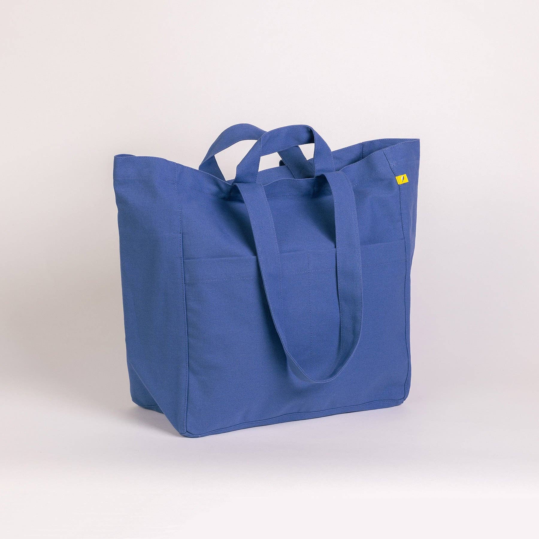 Blue tote bag on a light gray background