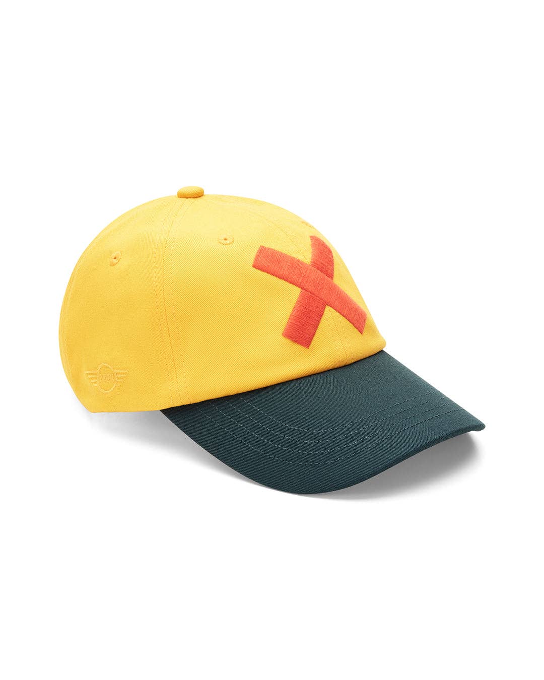 Yellow and green cap with red 'X' on a white background