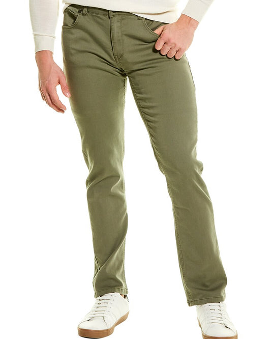 Person wearing olive green pants and white sneakers on a white background
