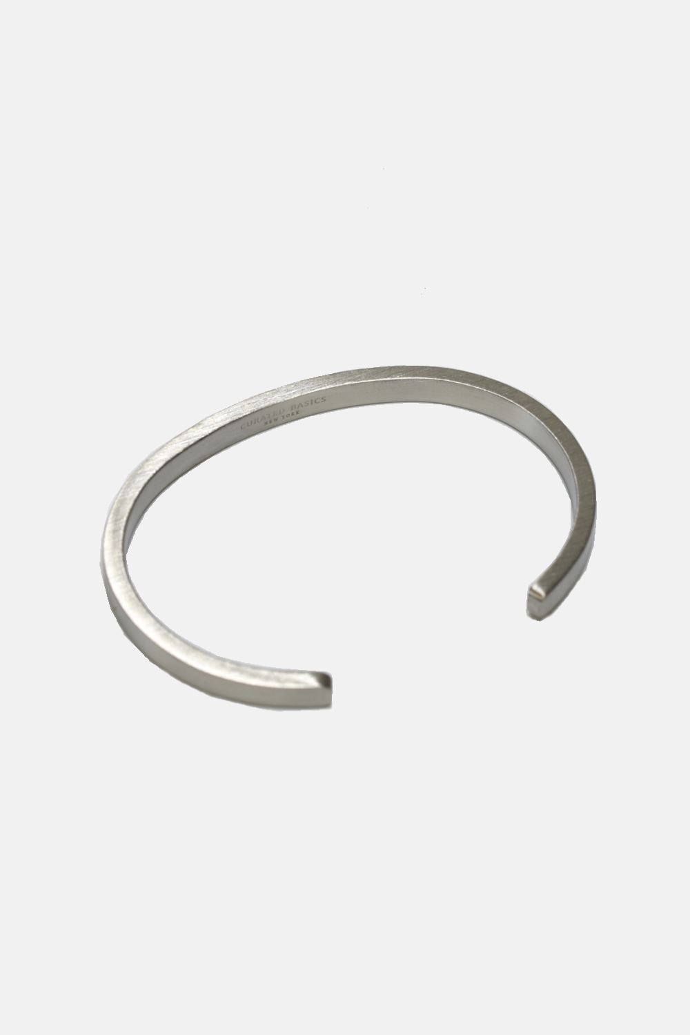 Silver bangle on a white background