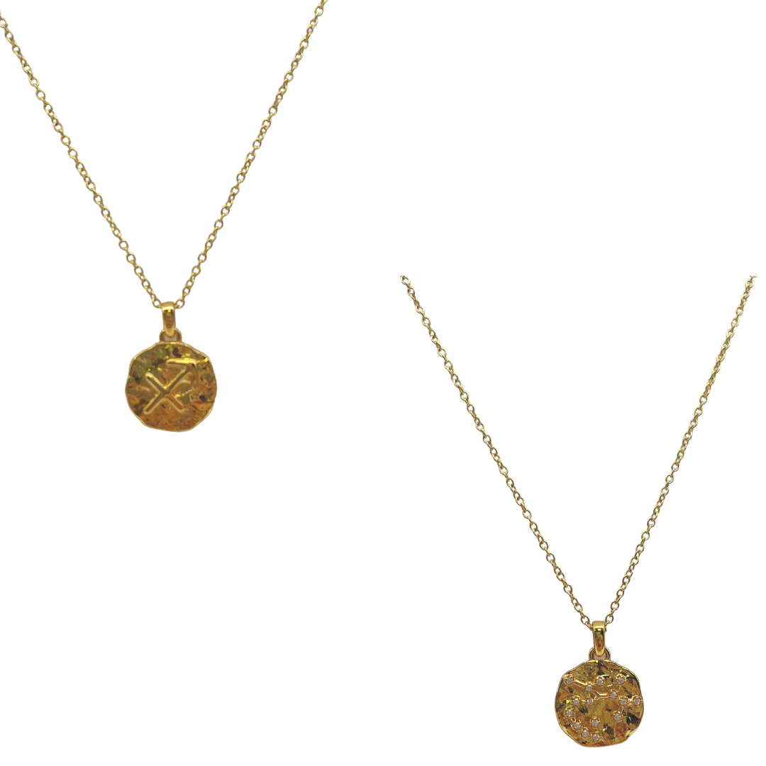 Two gold necklaces with circular pendants on a white background