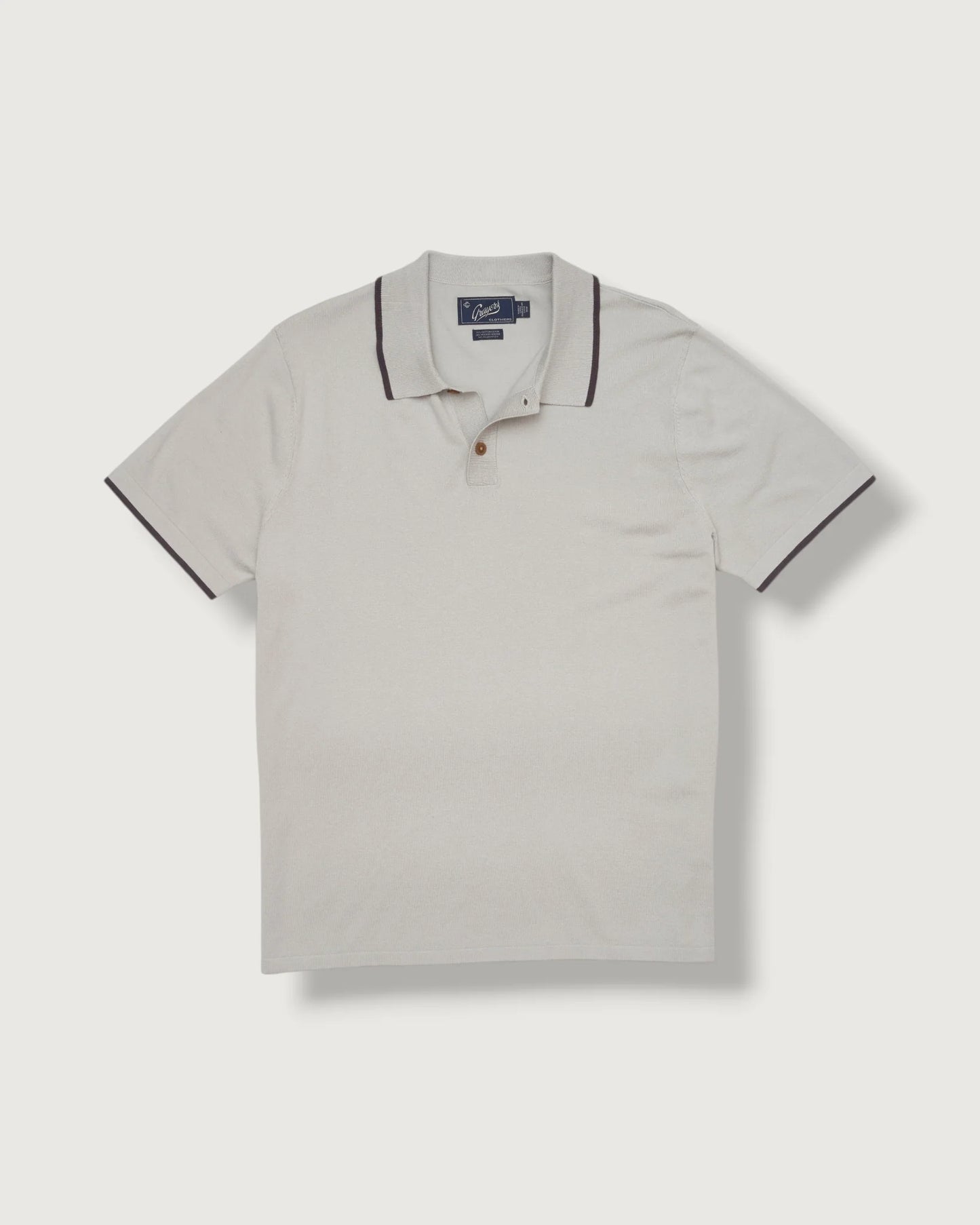 Light gray polo shirt with black trim on a white background