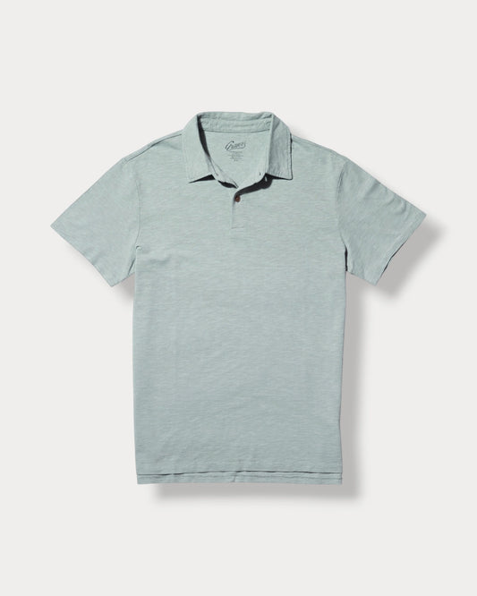 Light blue polo shirt with black trim on a white background