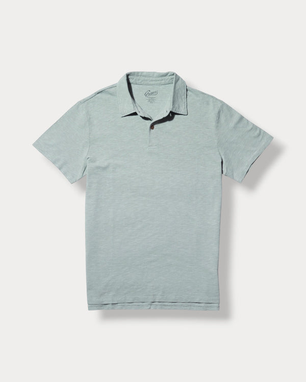 Light blue polo shirt with black trim on a white background