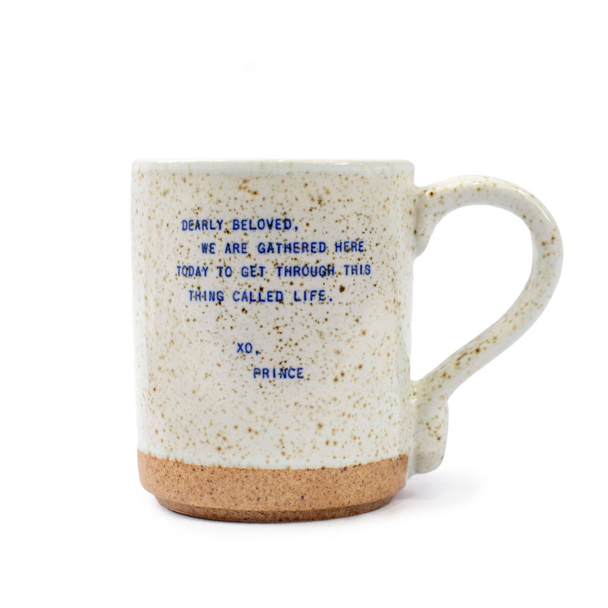 Speckled mug with blue text on a white background