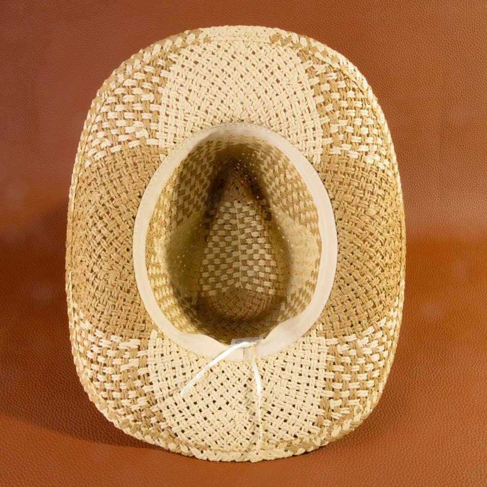 Woven straw hat on a brown background