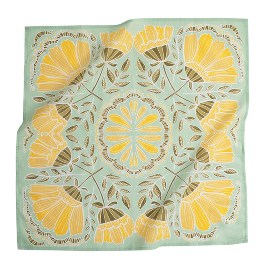 A square scarf with a symmetrical floral mandala pattern, featuring yellow and gold flowers with brown leaves on a light sage green background.