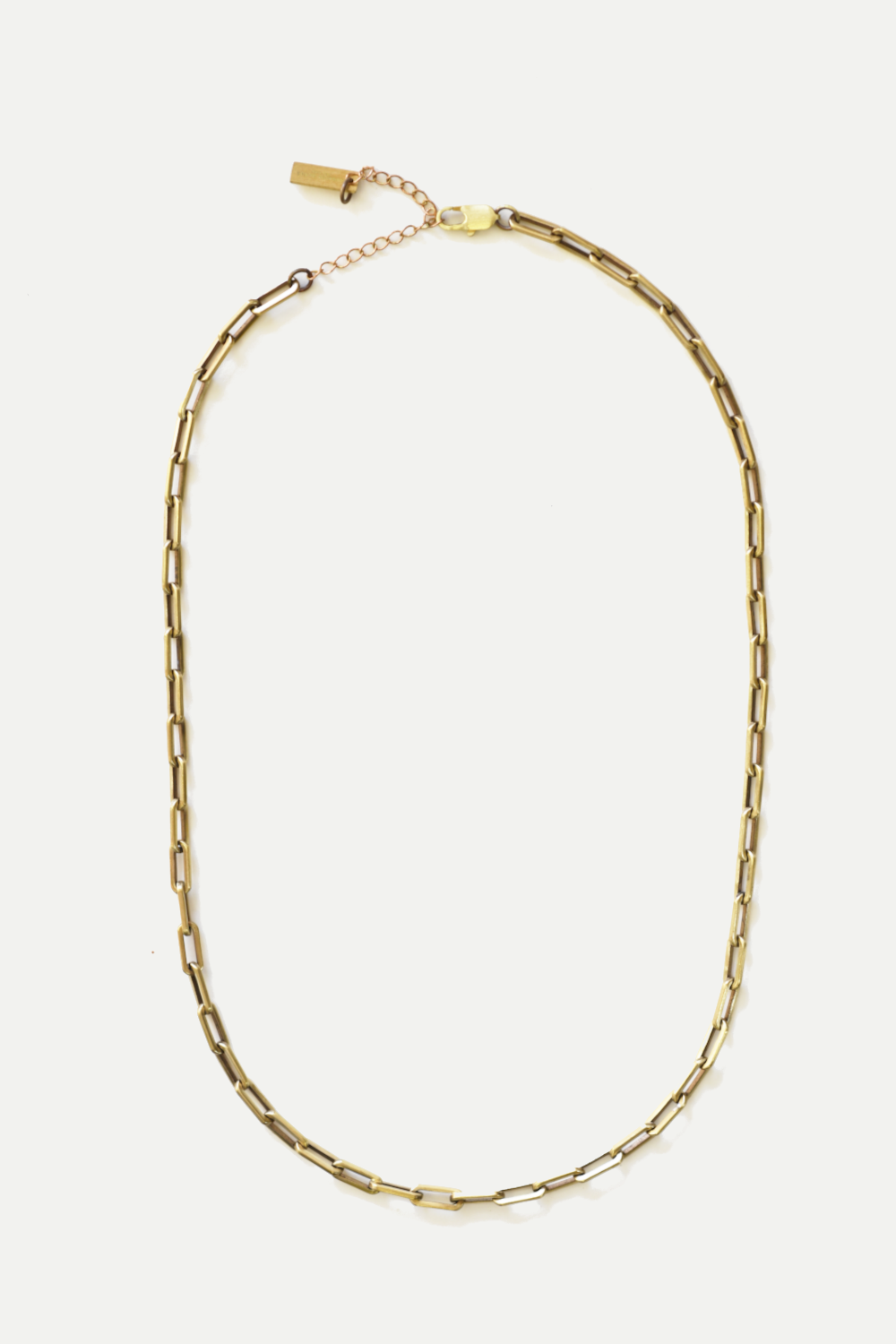 Gold chain necklace on a white background