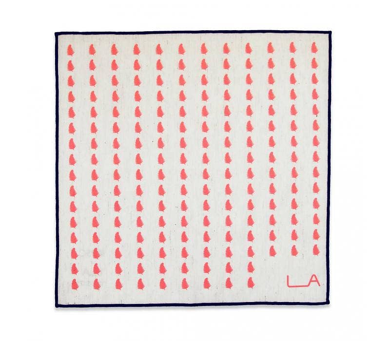 Square scarf with red pattern and 'LA' logo on a white background