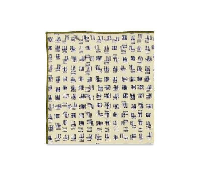 Fabric swatch with a blue and white pattern on a beige background