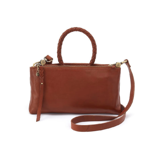 A brown leather handbag with a braided top handle, a matching shoulder strap, and gold-tone hardware, shown on a plain white background.
