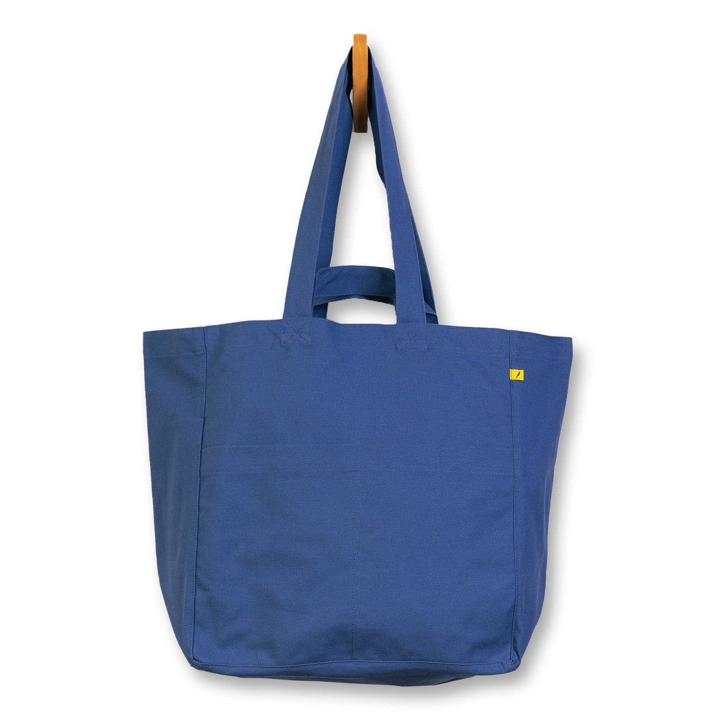 Blue tote bag with a yellow label on a white background