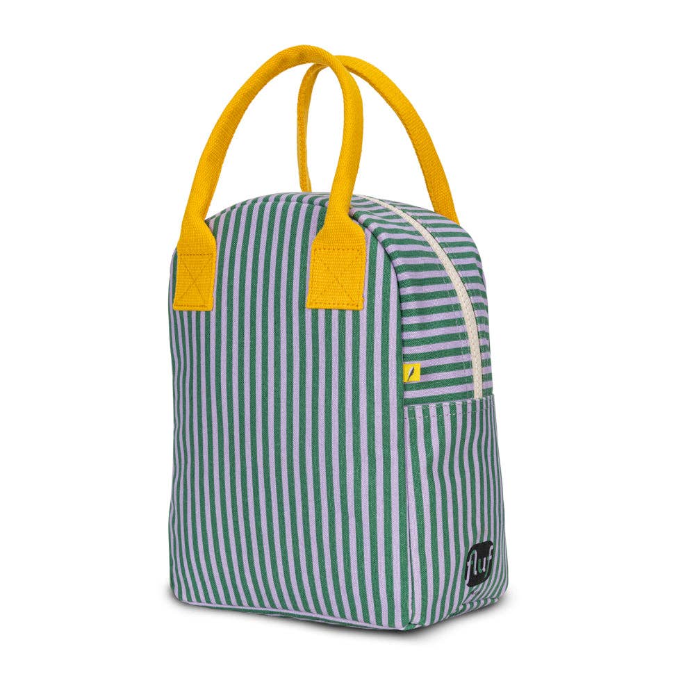 Green and white striped bag with yellow handles on a white background