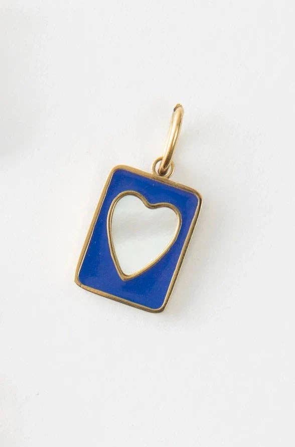 Gold pendant with a blue border and heart cutout on a white background