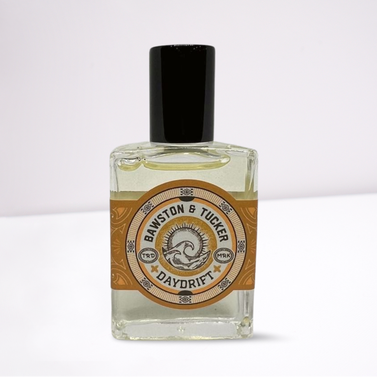 Perfume bottle with a decorative label on a white background
