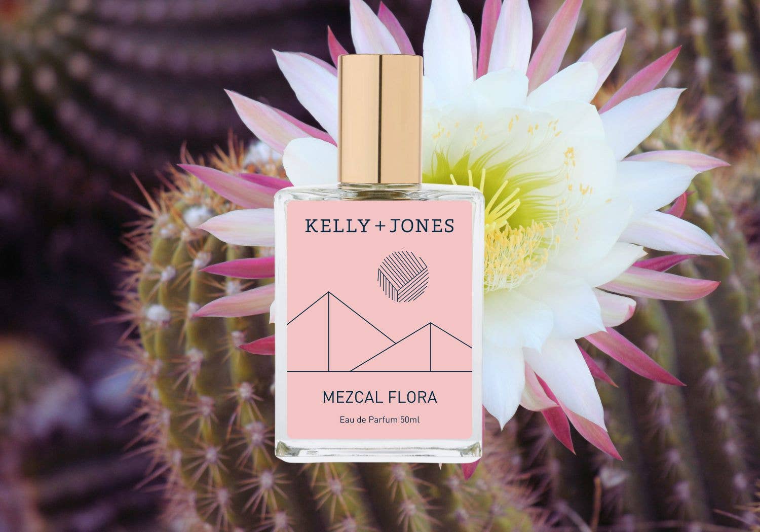 Kelly + Jones perfume bottle with a cactus and flower in the background