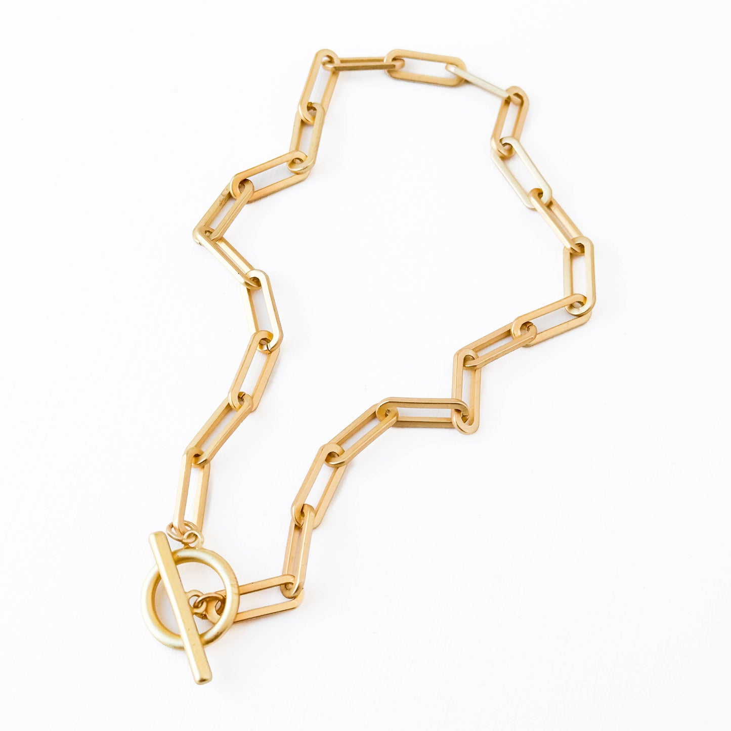 Gold chain necklace on a white background