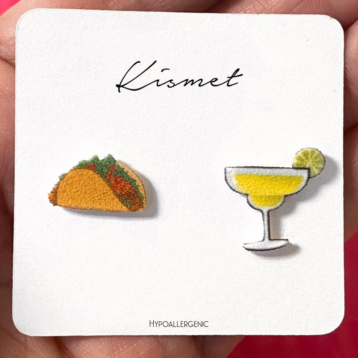 Taco and margarita earrings on a 'Kismet' branded card.