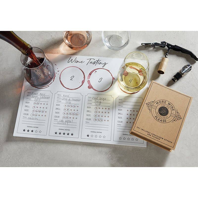 Wine tasting setup with glasses, a bottle, and a tasting sheet on a table.
