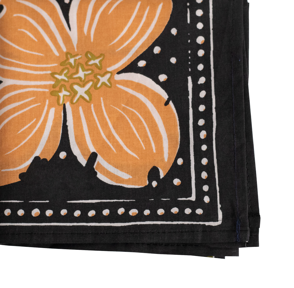 Black bandana with orange floral design on a white background