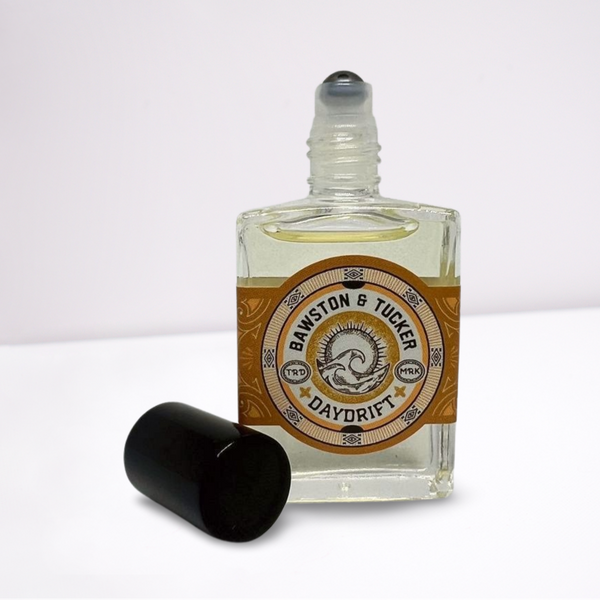 Roll-on perfume bottle with a label on a white background