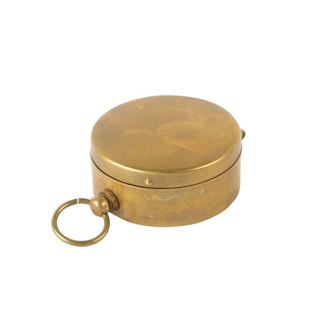 Brass compass on a white background
