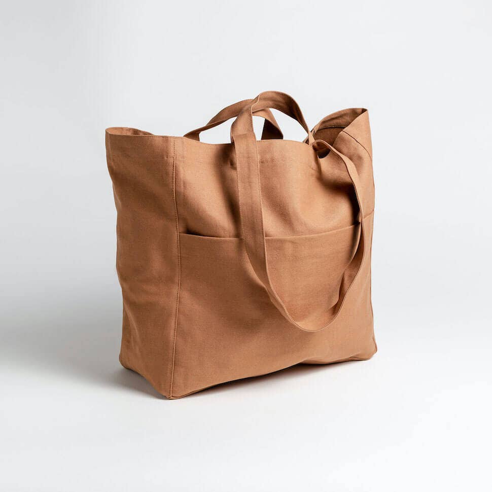 Brown tote bag on a light gray background