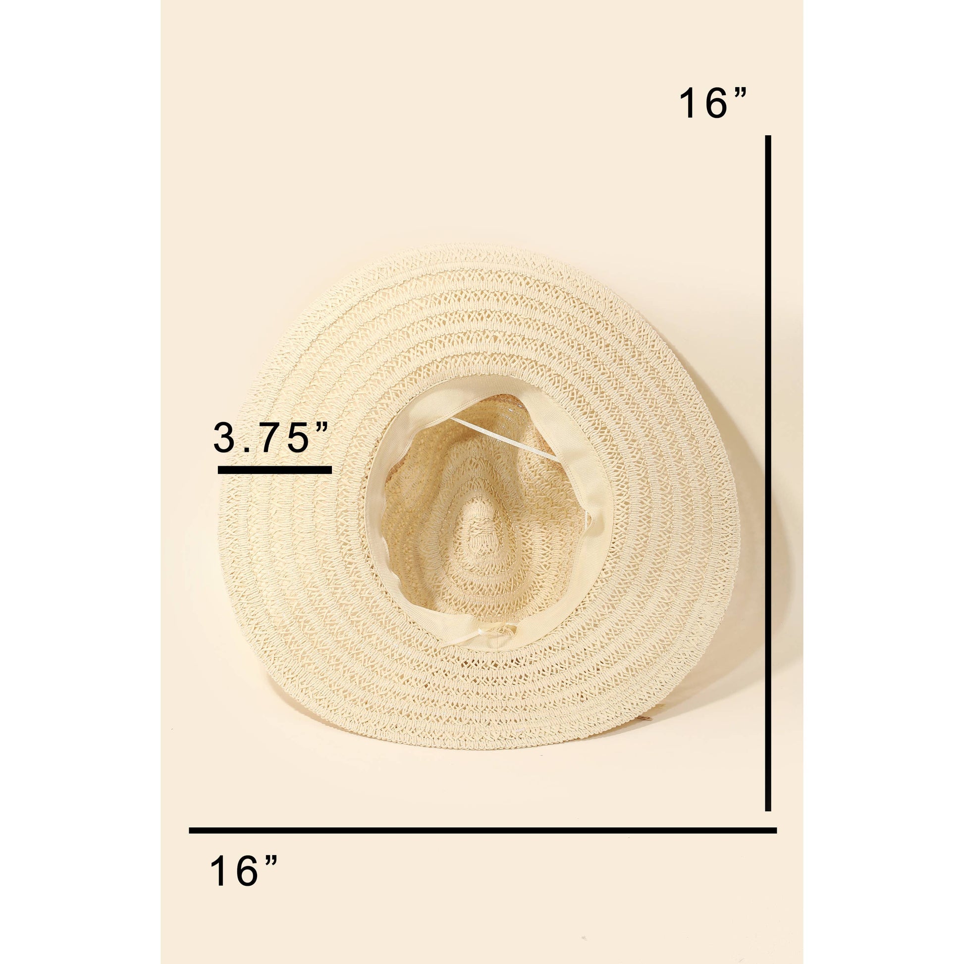 Beige straw hat with measurements on a beige background