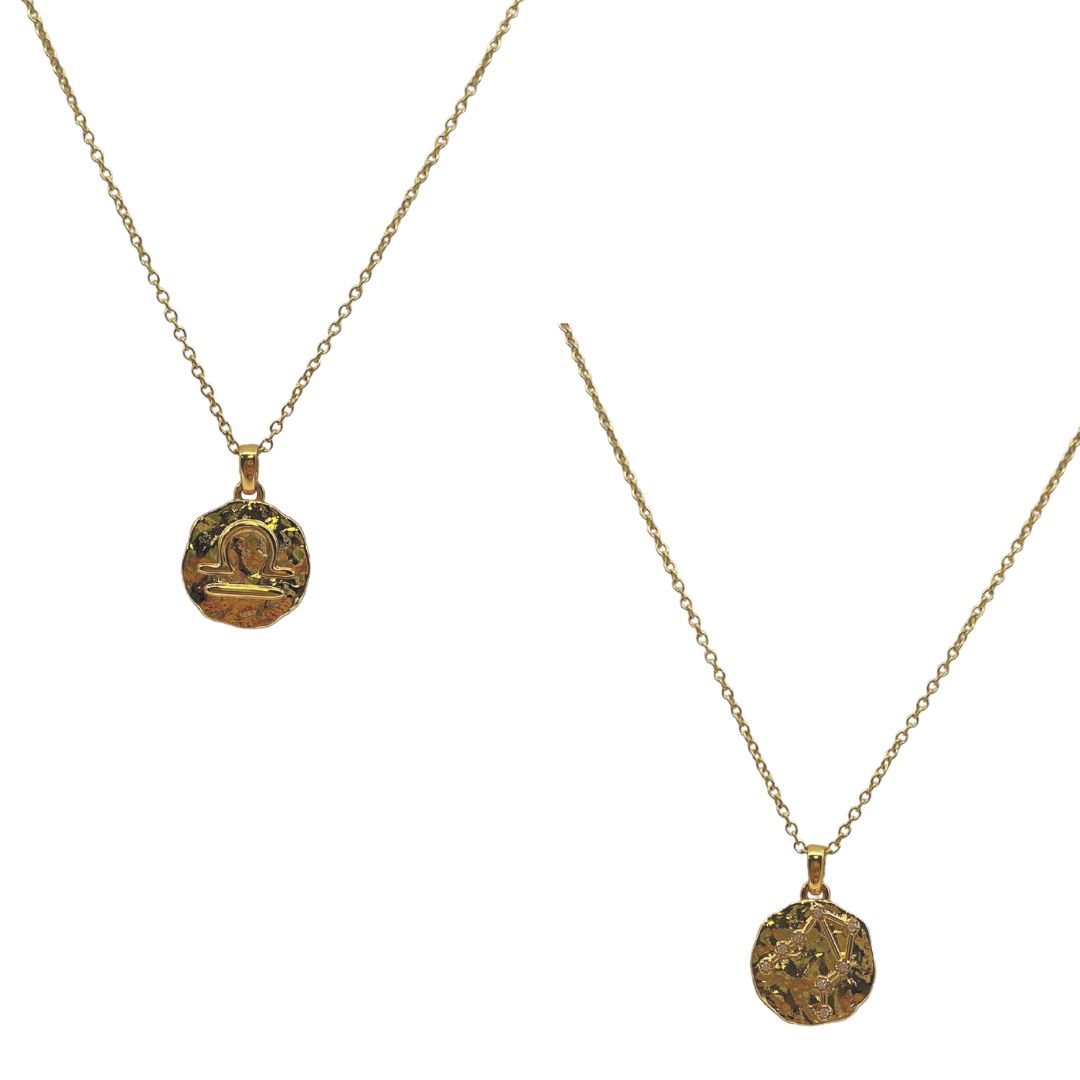 Two gold necklaces with circular pendants on a white background