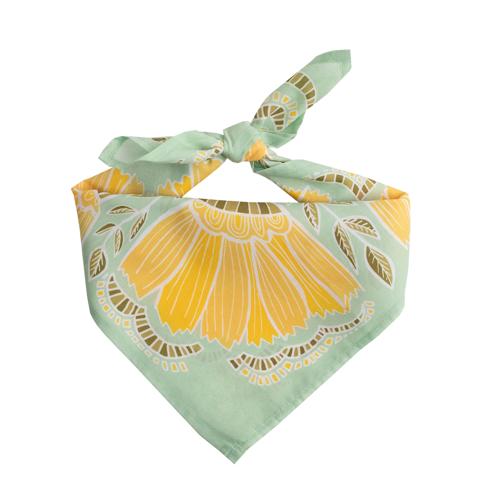 Green and yellow patterned bandana on a white background