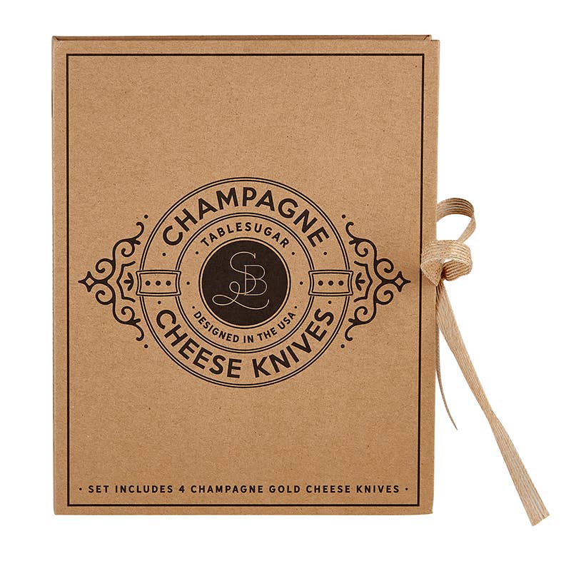 Kraft paper box with 'Champagne Cheese Knives' branding and a ribbon on a white background