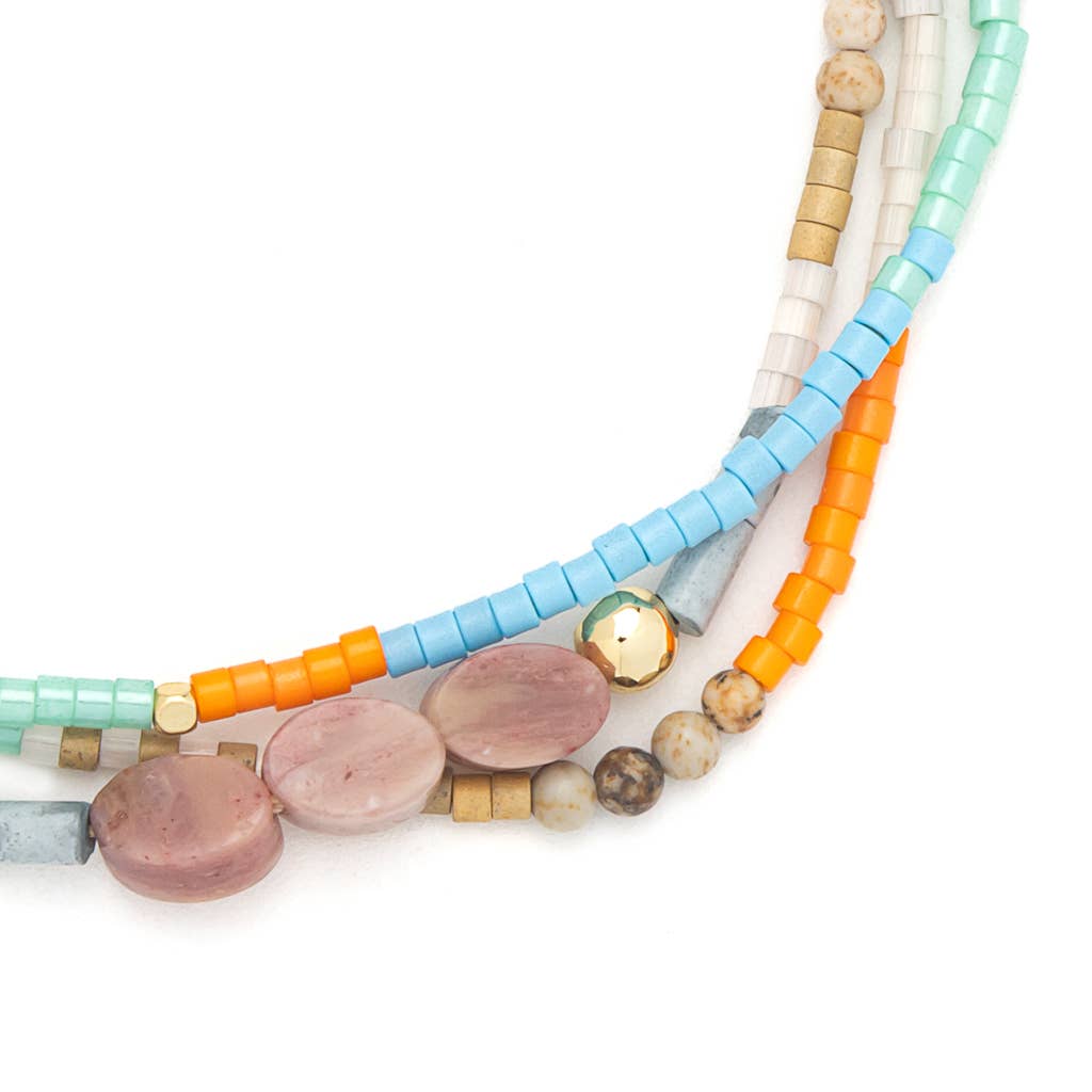 Colorful beaded necklaces on a white background